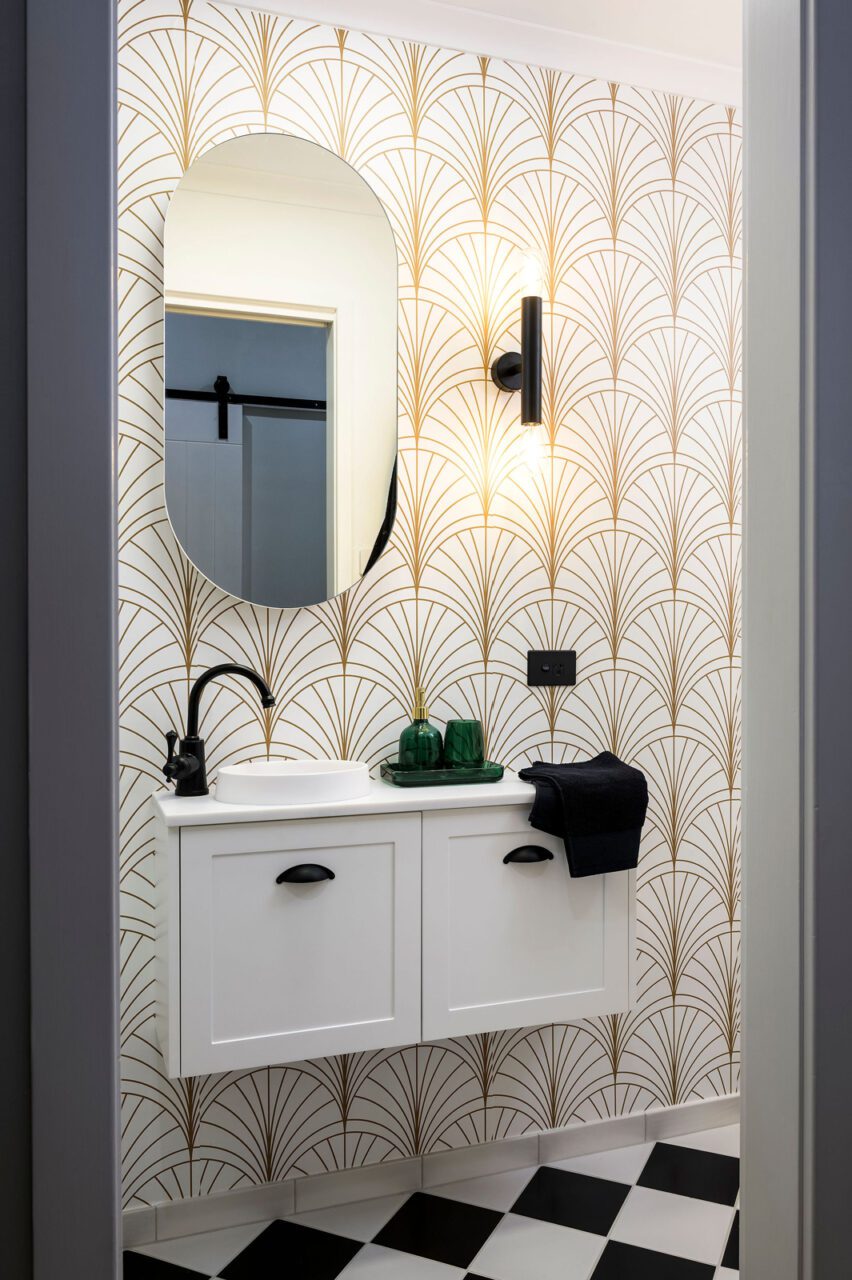 Art Deco Bathroom With Black Tapware and Gold Patterned Wallpaper