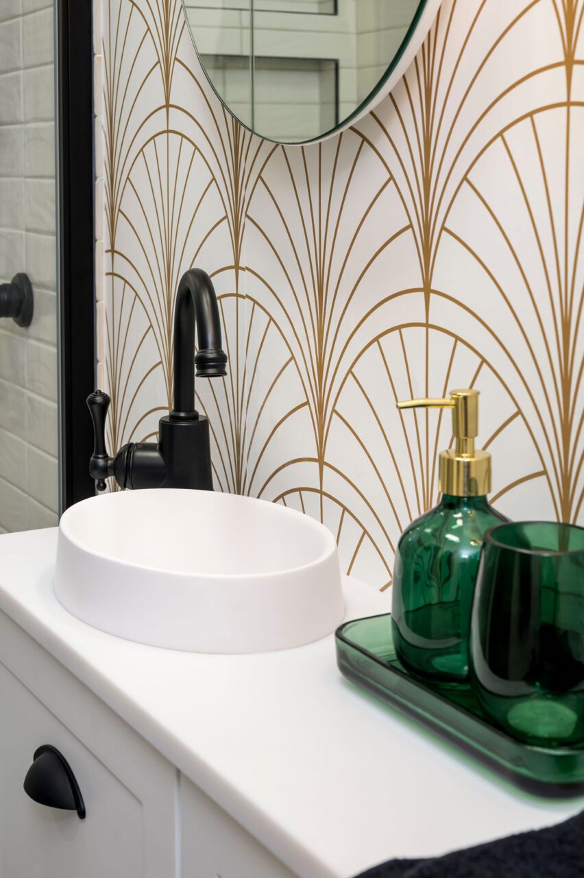 Art Deco Bathroom With Black Tapware and Gold Patterned Wallpaper