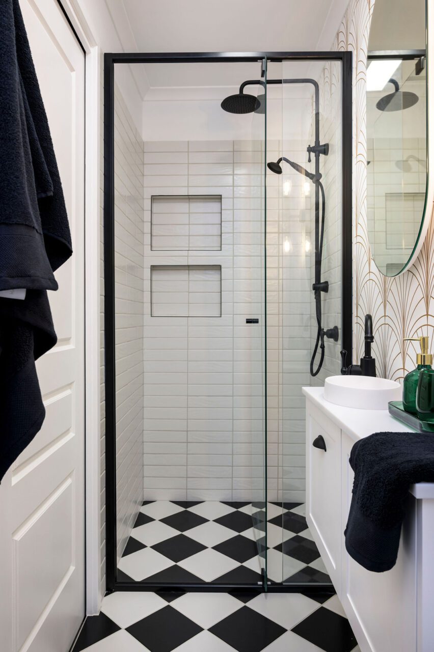 Art Deco Bathroom With Black Tapware and Gold Patterned Wallpaper