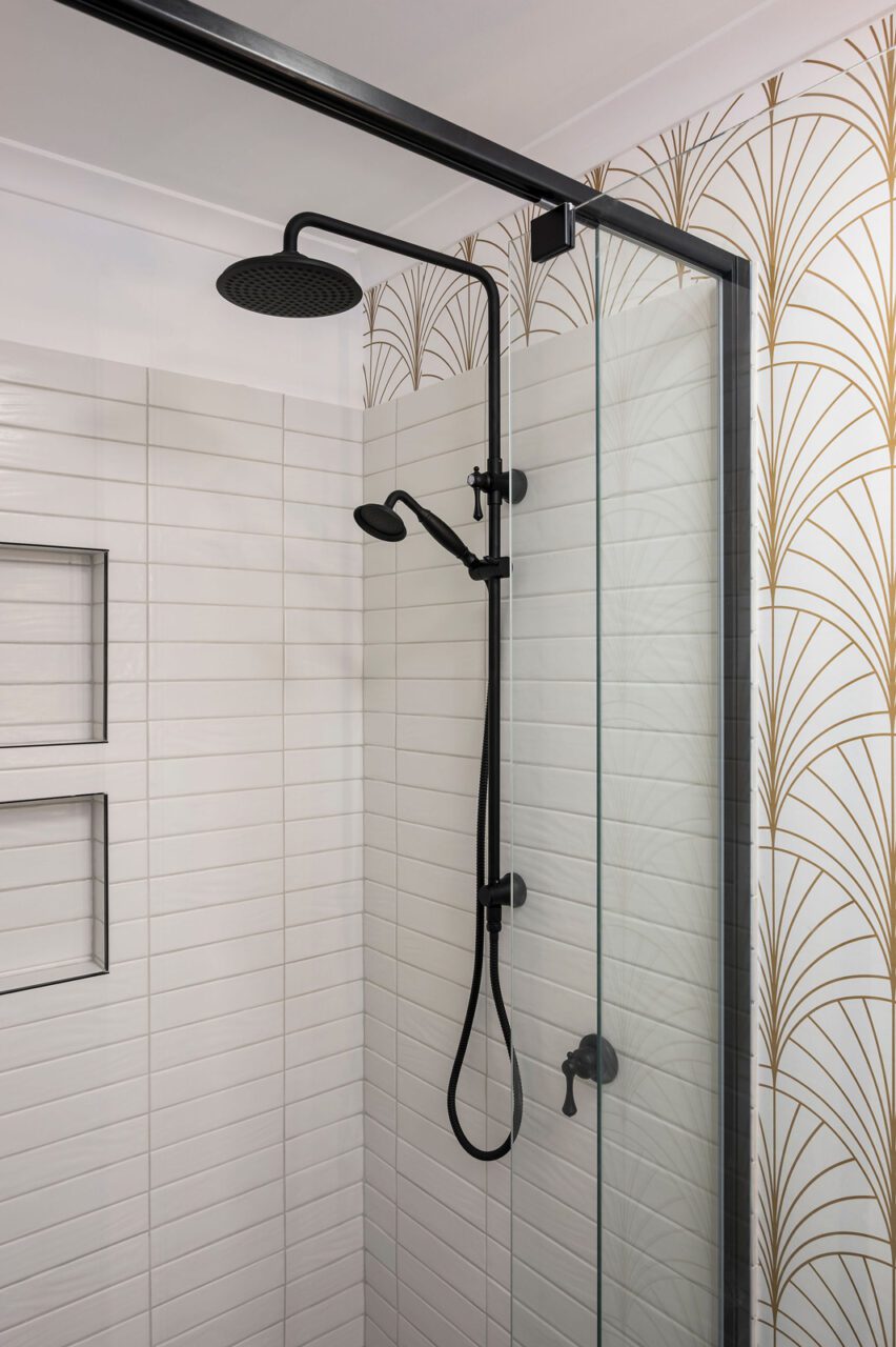 Art Deco Bathroom With Black Tapware and Gold Patterned Wallpaper