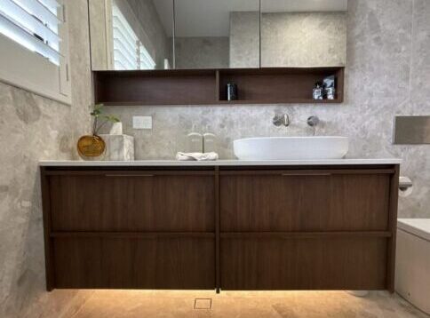 Custom timber wall hung vanity with ADP Monroe basin and shaving cabinet in a Cooks Hill bathroom renovation